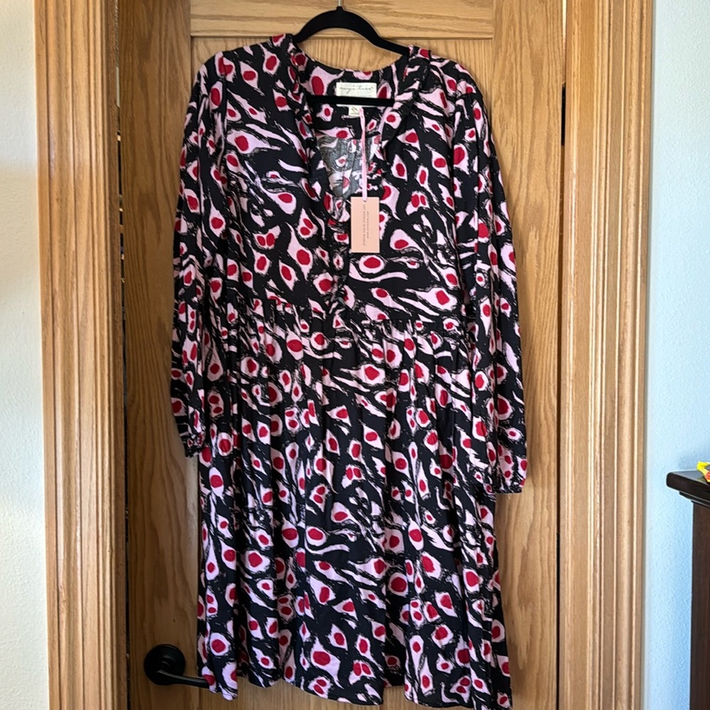 NWT Celeste dress by Evy’s tree. Long sleeve with ruffle detail around v neck.